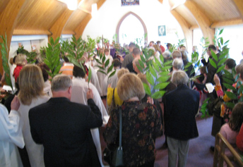 People holding palm branches on Palm Sunday.
